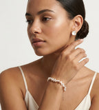 A woman wearing 18K Gold-plated on S925 Sterling Silver double-strand baroque pearl bracelet | BUCKLE Collective
