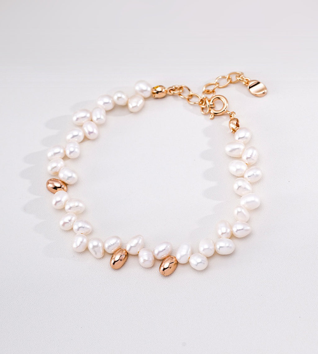 18K Gold-plated on S925 Sterling Silver double-strand baroque pearl bracelet with polished gold accents and a gold-tone lobster clasp | BUCKLE Collective