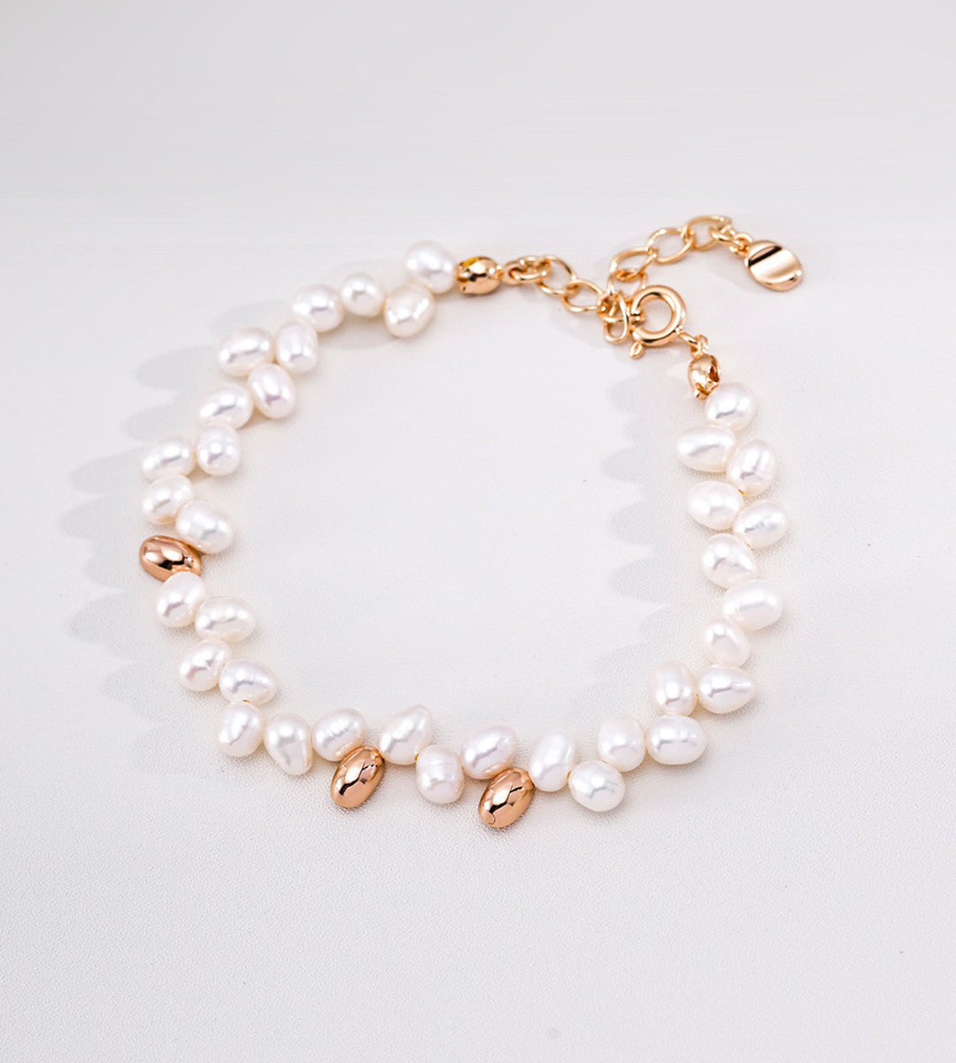 18K Gold-plated on S925 Sterling Silver double-strand baroque pearl bracelet with polished gold accents and a gold-tone lobster clasp | BUCKLE Collective