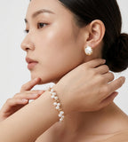 An asian woman wearing 18K Gold-plated on S925 Sterling Silver double-strand baroque pearl bracelet | BUCKLE Collective