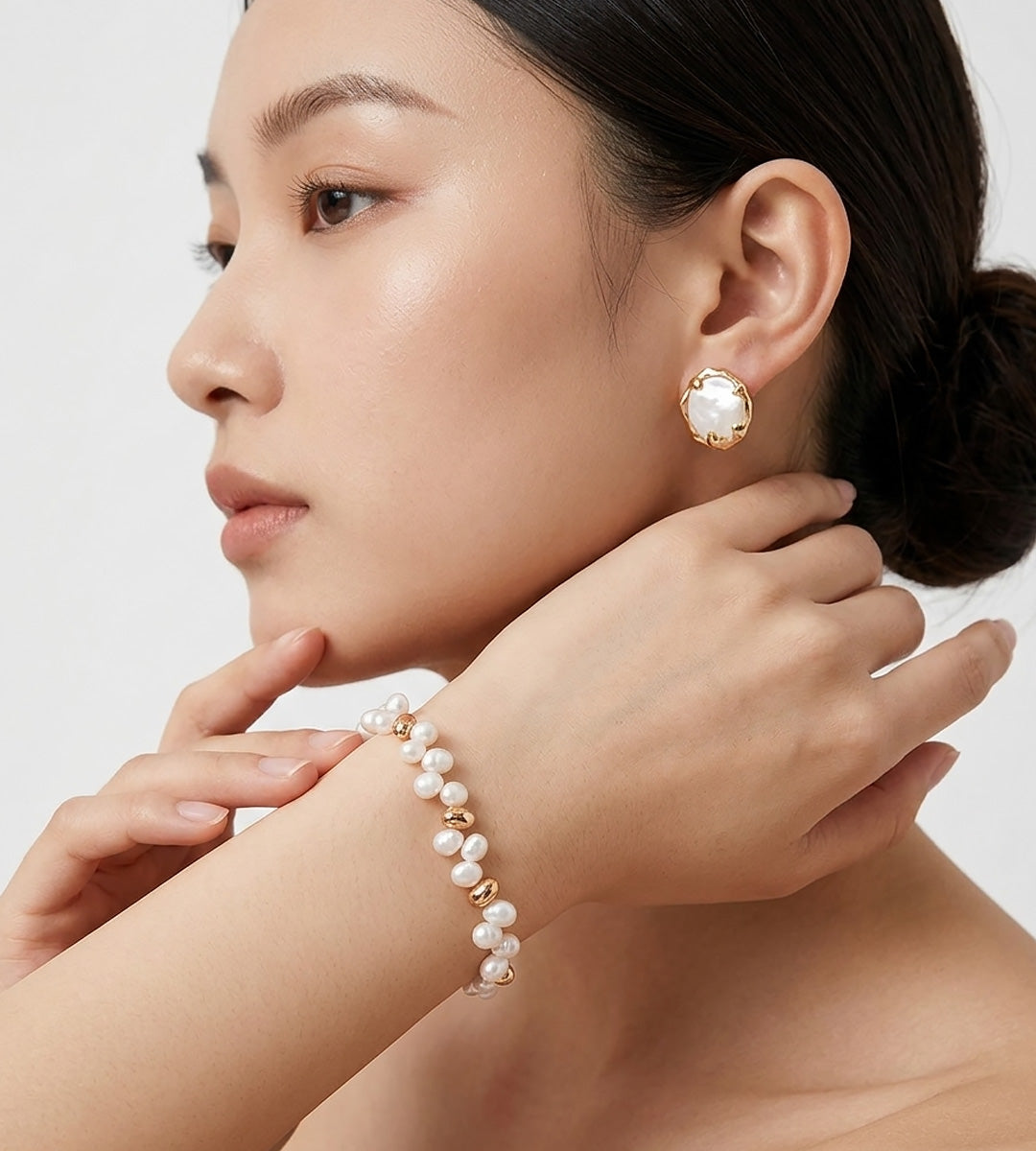 An asian woman wearing 18K Gold-plated on S925 Sterling Silver double-strand baroque pearl bracelet | BUCKLE Collective