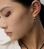 A close-up of a model wearing Lapis Lazuli Textured Square Drop Earrings 18K gold-plated S925 sterling silver | BUCKLE Collective