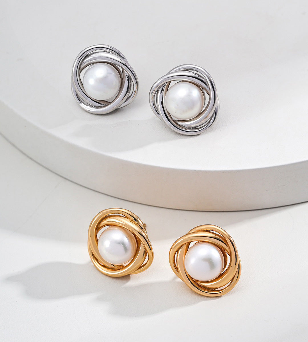 A two pairs of Natural Pearl Twist Stud Earrings in 18K White Gold-Plated and 18K Gold-Plated on S925 Sterling Silver | BUCKLE Collective