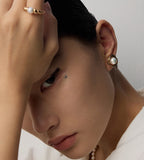 A woman wearing Natural Pearl Twist Stud Earrings 18K Gold-Plated on S925 Sterling Silver | BUCKLE Collective