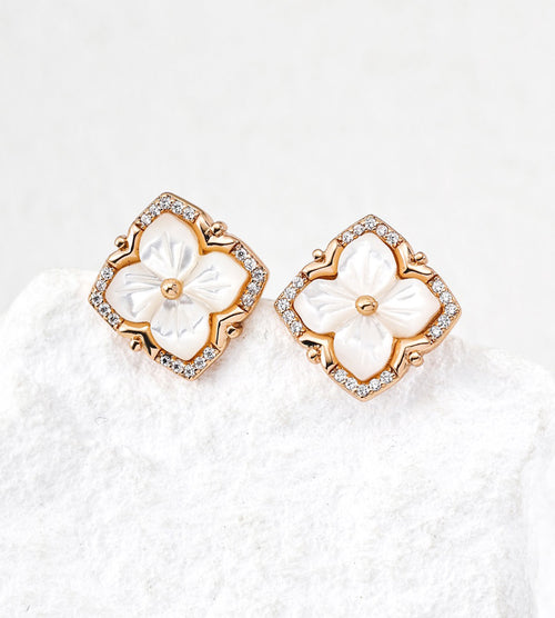 A pair of 18K Gold Plated S925 Silver floral stud earrings with white mother-of-pearl flower centers and cubic zirconia halos