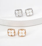 A two pairs of 18K Gold and White Gold Plated S925 Silver floral stud earrings with white mother-of-pearl flower centers and cubic zirconia halos