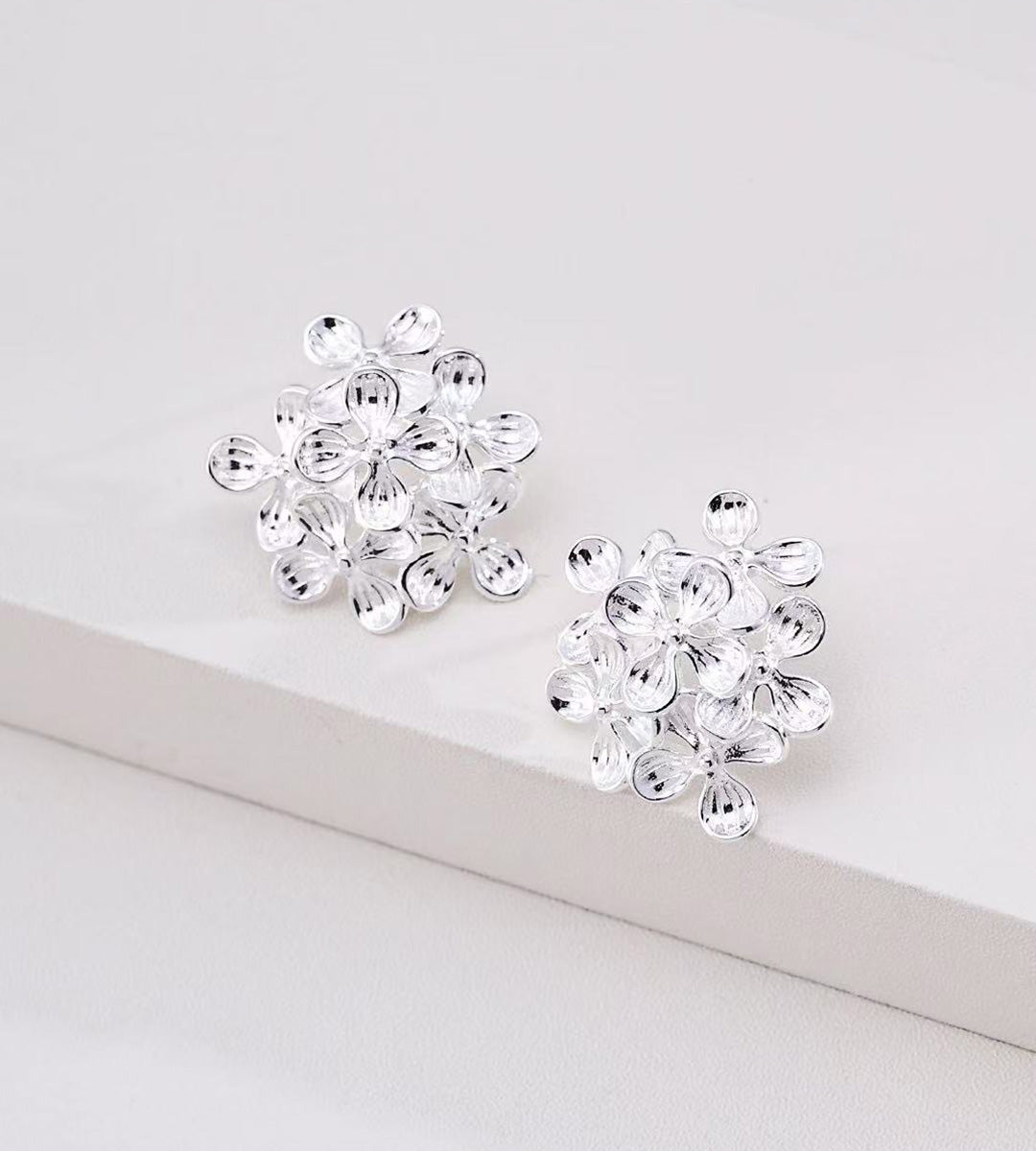 A pair of 18K White Gold Plated over S925 Silver Multi-Petal Flower Cluster Earrings