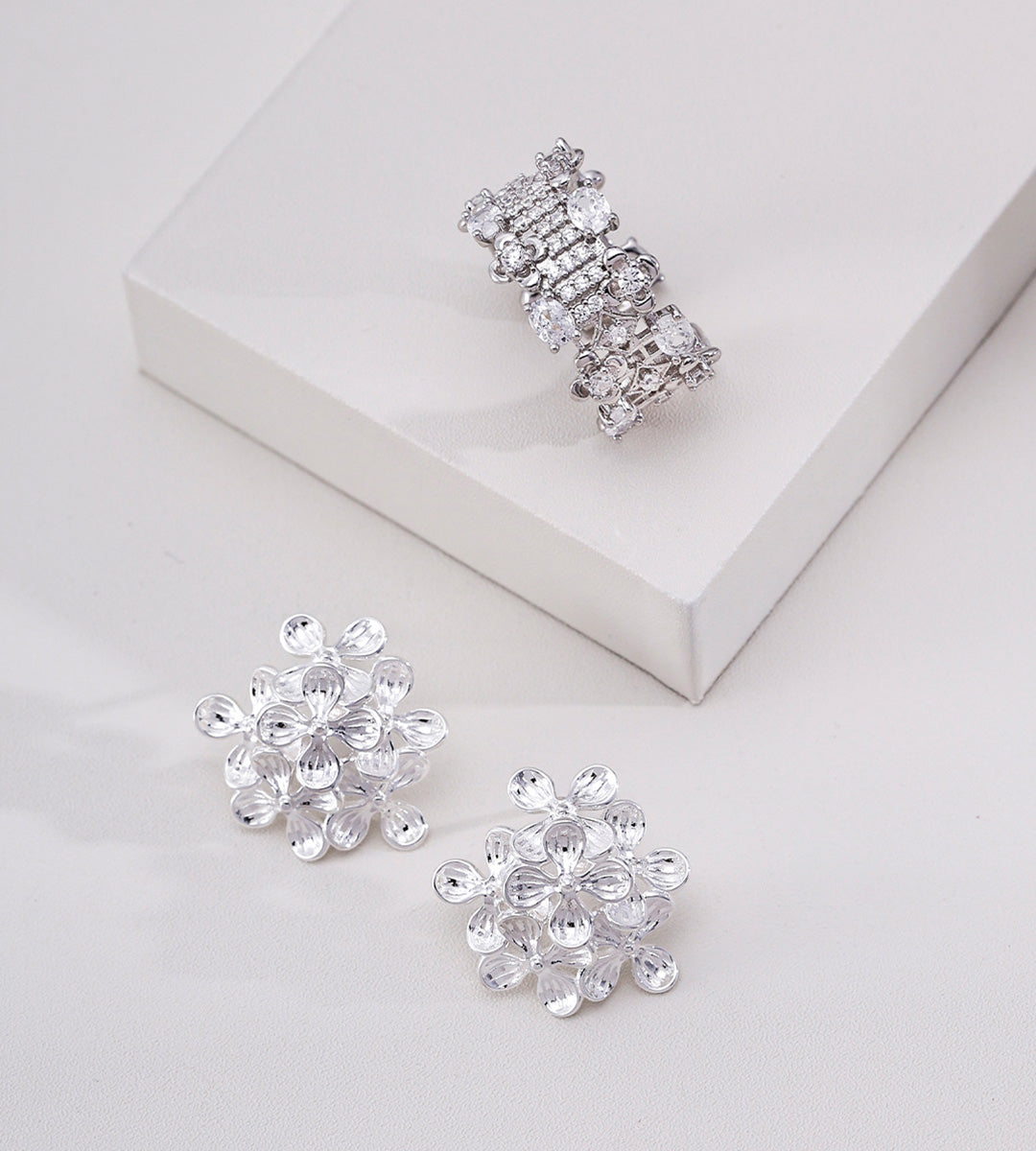A pair of 18K White Gold Plated S925 Silver Multi-Petal Flower Cluster Earrings and Matching Ring Set