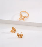 CNC embossed butterfly stud earrings and matching butterfly open ring in vintage gold — 3D sculpted wing detail with marquise cubic zirconia, 18K gold plated S925 sterling silver, BUCKLE Collective