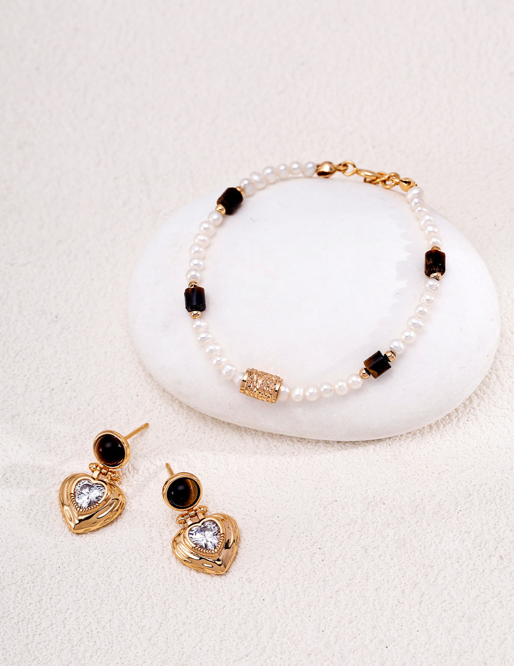 Natural pearl and tiger's eye beaded bracelet in vintage gold styled with tiger's eye heart CZ drop earrings — freshwater pearls, filigree barrel bead, rectangular tiger's eye beads, 18K gold plated S925 silver, BUCKLE Collective