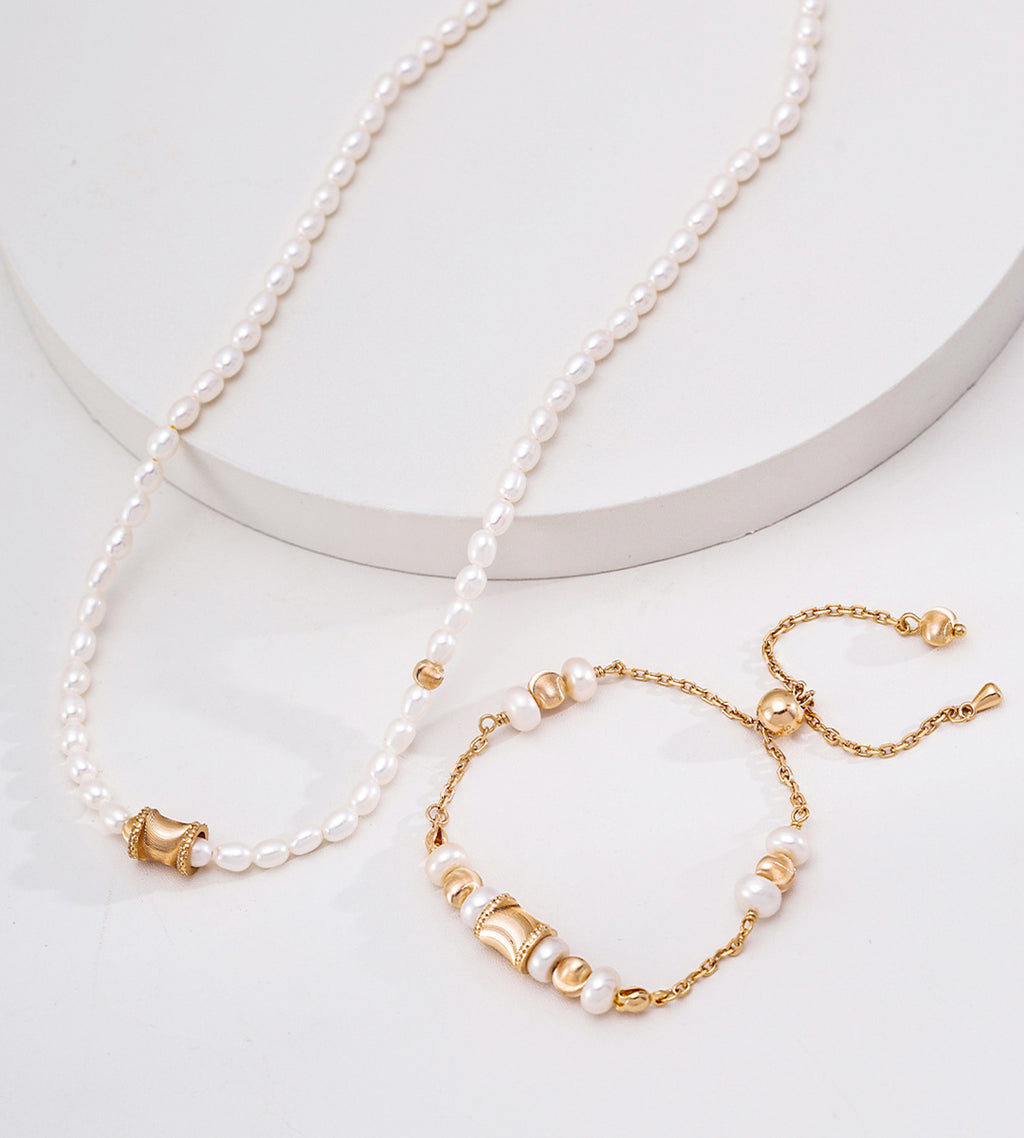 Adjustable freshwater pearl bracelet in vintage gold styled with pearl necklace — wasp-waist charm, round polished beads, pull-slide clasp, 18K gold plated S925 silver, BUCKLE Collective