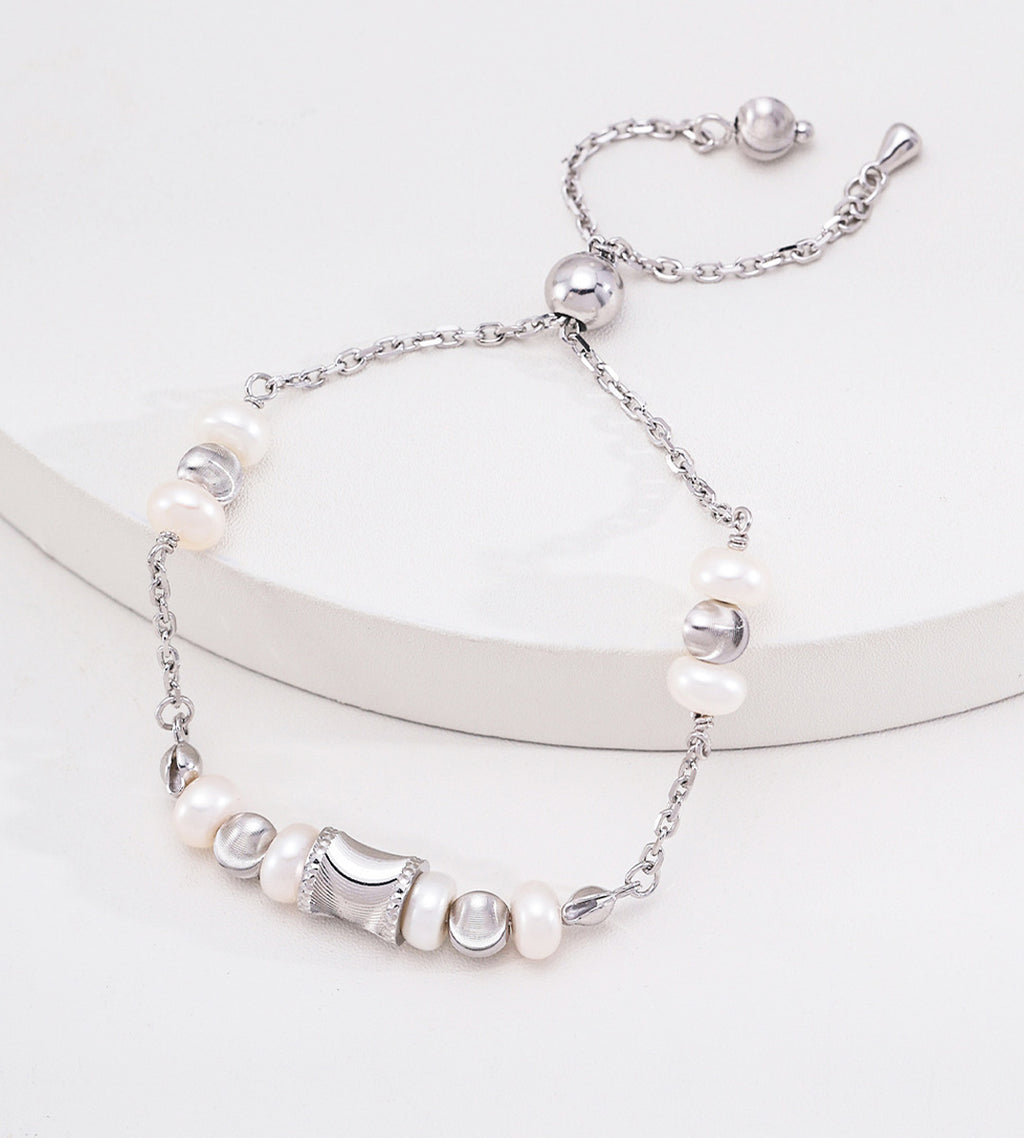 Adjustable freshwater pearl bracelet in white gold silver — wasp-waist charm, round spacer beads, pull-slide slider clasp, S925 sterling silver, BUCKLE Collective

