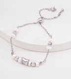 Adjustable freshwater pearl bracelet in white gold silver — wasp-waist charm, round spacer beads, pull-slide slider clasp, S925 sterling silver, BUCKLE Collective

