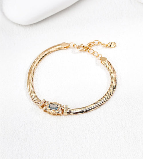 18K gold-plated S925 silver snake chain bracelet with an Art Deco-inspired rectangular CZ centre, lobster clasp and extension chain.