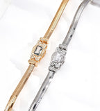 Close-up of Vintage Gold and silver-tone snake chain bracelets, showing rectangular cubic zirconia centres and sparkling geometric side details.