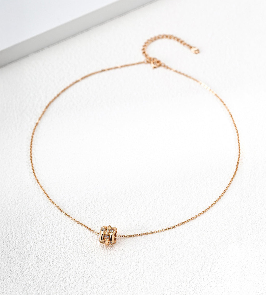 18K gold-plated S925 silver bamboo-barrel cubic zirconia necklace with a fine chain and extender on a white surface.