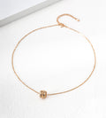 18K gold-plated S925 silver bamboo-barrel cubic zirconia necklace with a fine chain and extender on a white surface.