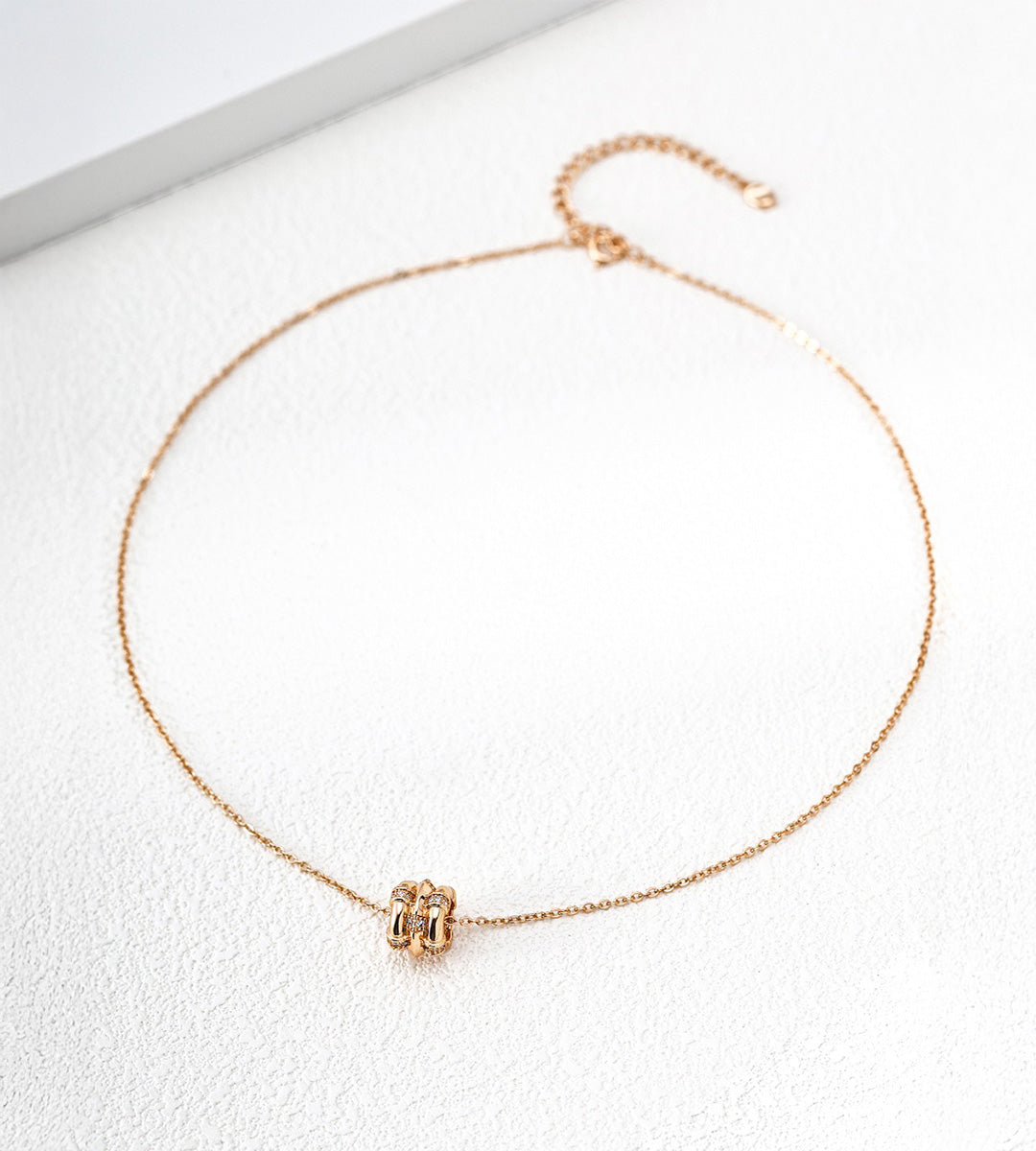18K gold-plated S925 silver bamboo-barrel cubic zirconia necklace with a fine chain and extender on a white surface.
