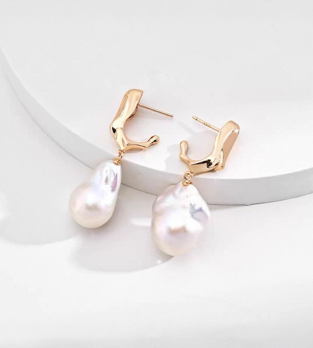 18K gold-plated S925 sterling silver baroque pearl drop earrings with sculptural tops on a white display
