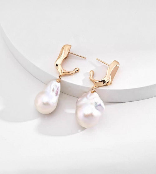 18K gold-plated S925 sterling silver baroque pearl drop earrings with sculptural tops on a white display