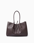 A dark brown woven leather large tote bag with double top handles and a drawstring detail