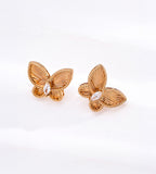 Vintage gold 18K plated S925 silver butterfly studs, precision carved embossed wings, pavé cubic zirconia accent, small elegant butterfly earrings on white background