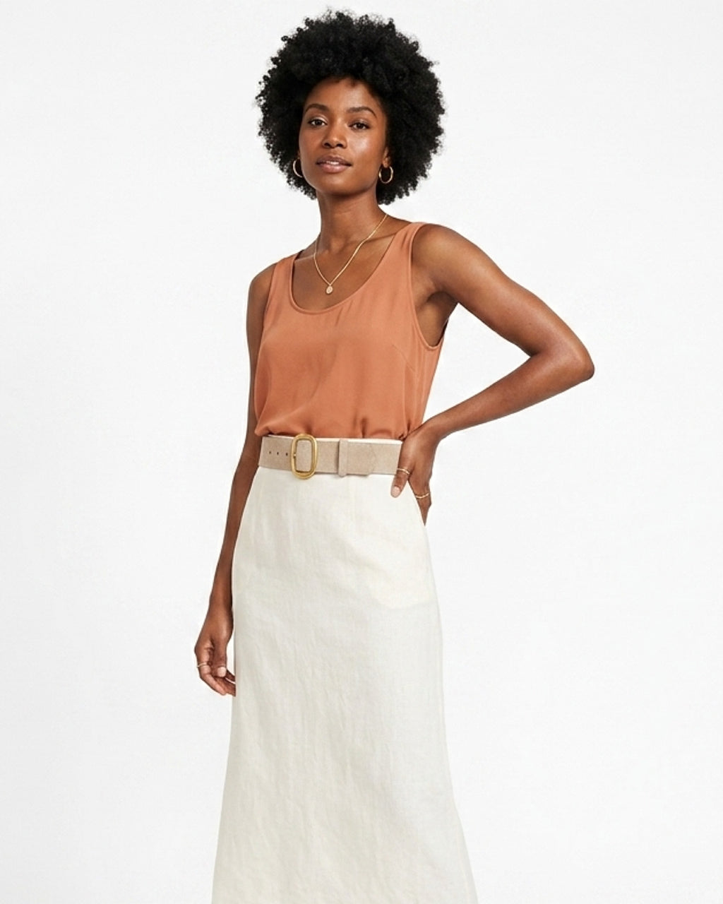 Woman wearing a brown sleeveless top and white skirt with Beige Suede Leather Belt with Gold Buckle