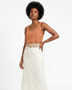 Woman wearing a brown sleeveless top and white skirt with Beige Suede Leather Belt with Gold Buckle