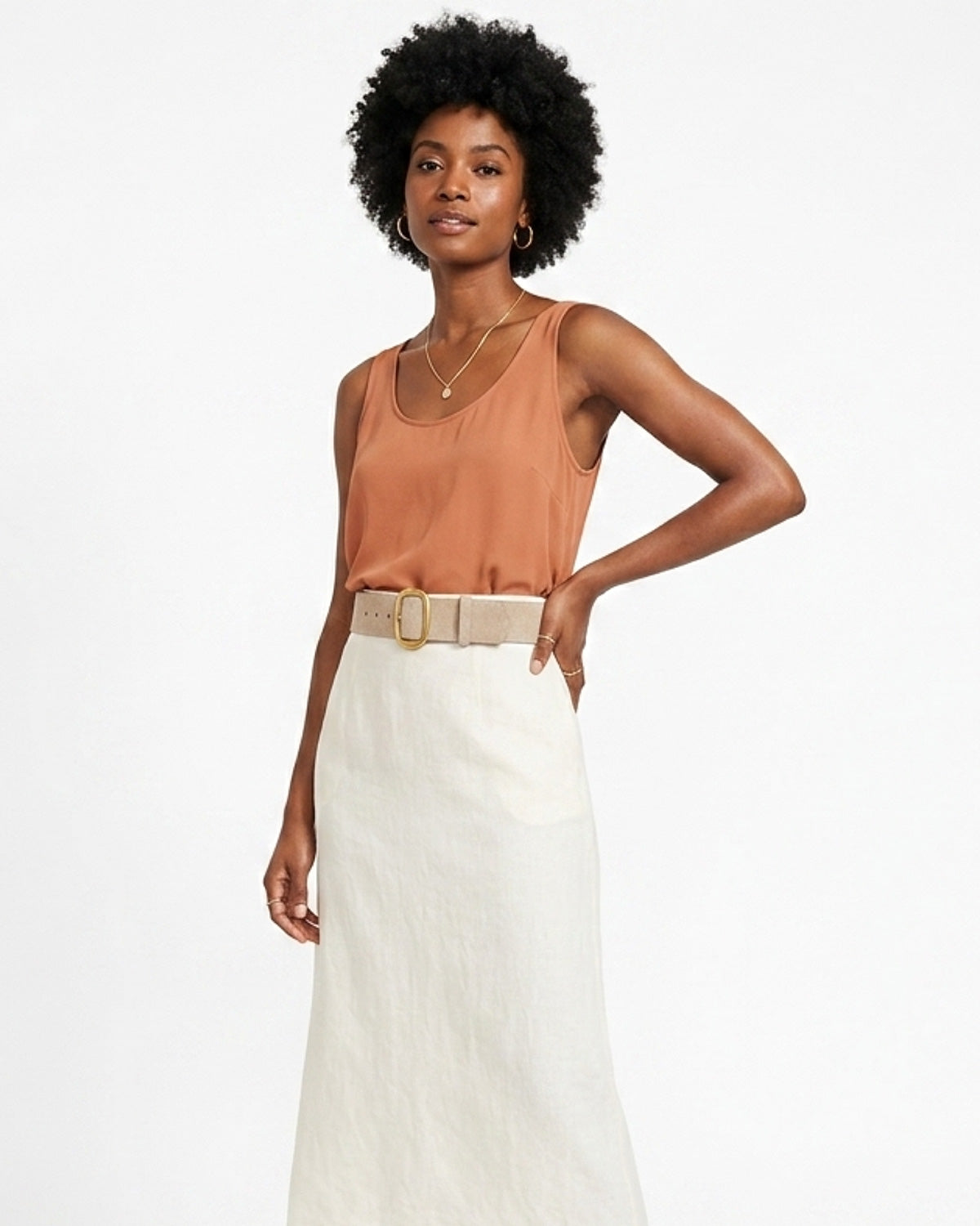 Woman wearing a brown sleeveless top and white skirt with Beige Suede Leather Belt with Gold Buckle