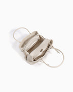 Interior details of an Off-White Commuter Genuine Togo Leather Satchel Bag with Turn-Lock & Detachable Strap | BUCKLE Collective