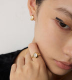Woman wearing an Elegant 18K Gold-Plated Mother of Pearl Ring with Mother of Pearl Earrings, S925 Silver