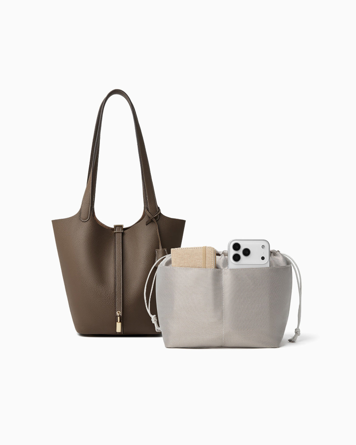 Extra Large Togo Leather Bucket Tote Bag in Elephant Grey Color with Gold-toned Lock shown next to a removable light gray drawstring pouch
