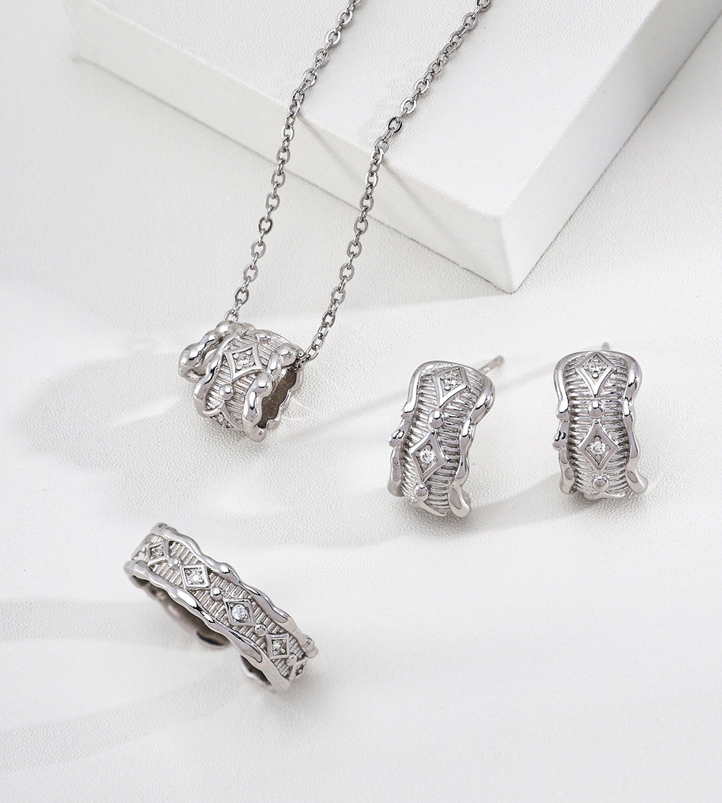 The Modern Minimalist Filigree Wheel Charm Necklace in a set with a pair of earrings and a ring, 18K Gold-Plated over S925 Sterling Silver, White Gold Color