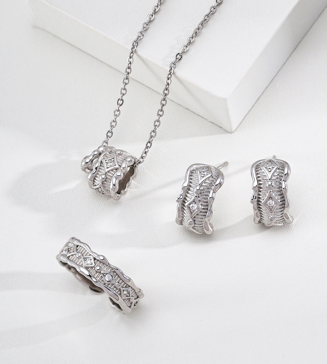 The Modern Minimalist Filigree Wheel Charm Necklace in a set with a pair of earrings and a ring, 18K Gold-Plated over S925 Sterling Silver, White Gold Color