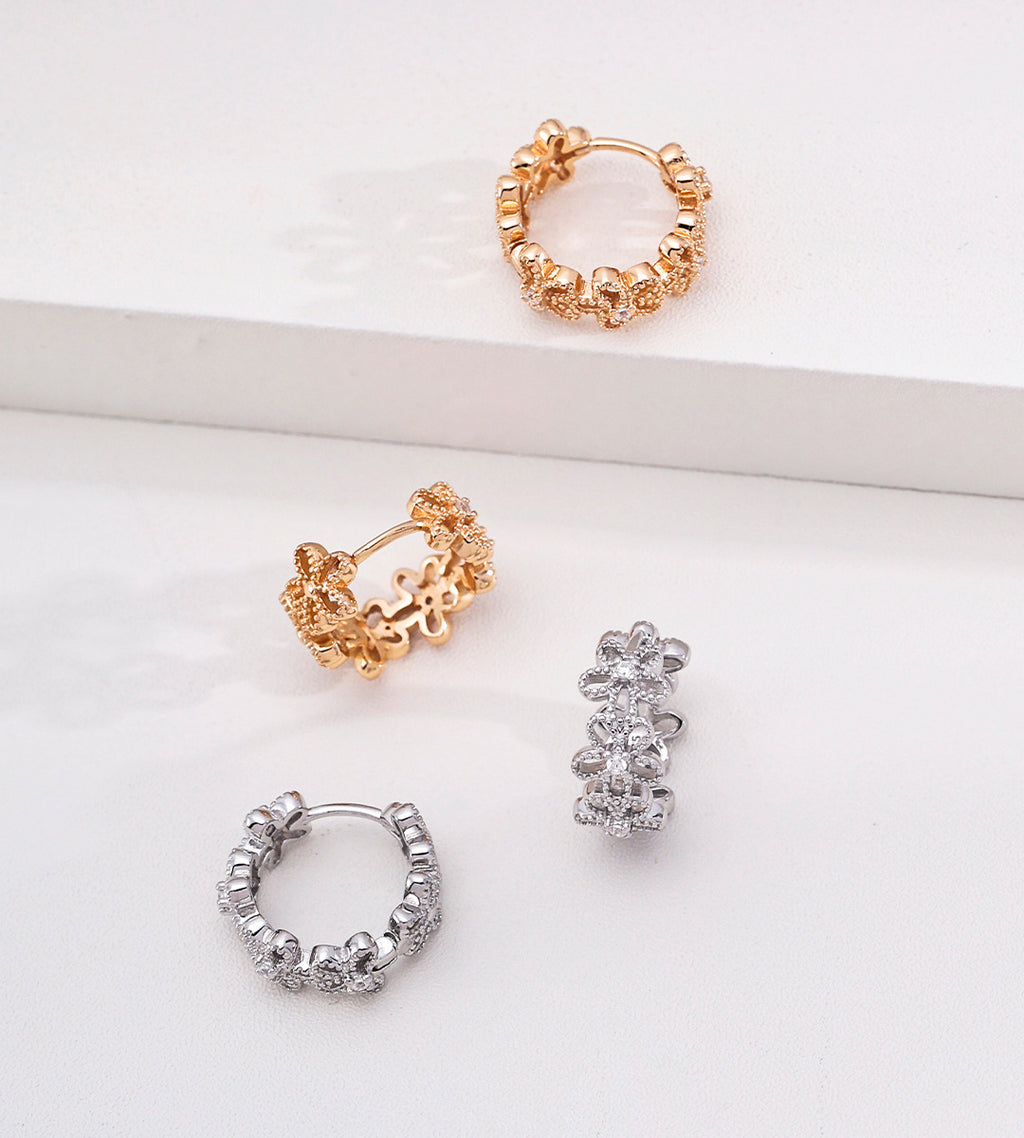 Floral hollow-carved huggie hoop earrings in vintage gold and white gold — CZ flower hoop both colourways comparison, 18K gold plated S925 sterling silver, BUCKLE Collective