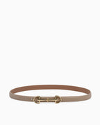 A slim khaki leather belt with a polished gold-tone horsebit buckle