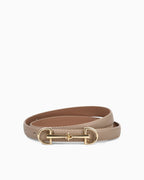 A slim khaki leather belt with a polished gold-tone horsebit buckle