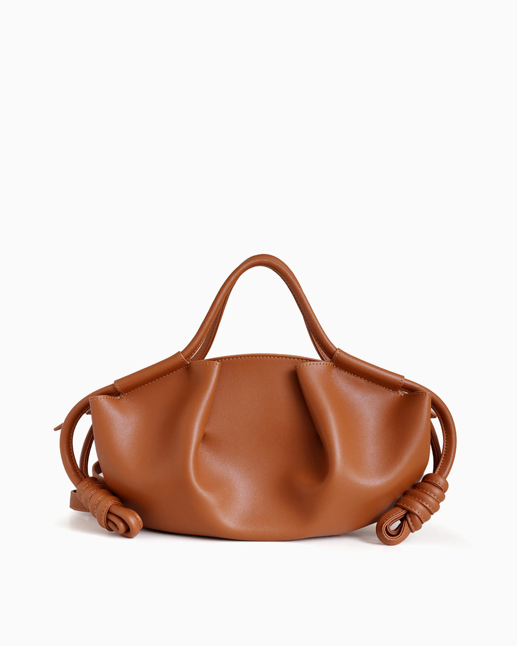 Caramel-colored Genuine Pleated Leather Dumpling Handbag with a slouchy, pleated silhouette, dual top handles, and knotted leather details on the sides | BUCKLE Collective