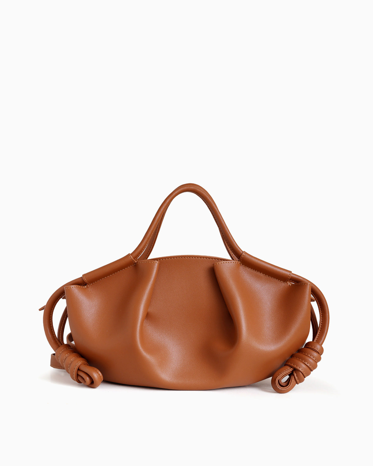 Caramel-colored Genuine Pleated Leather Dumpling Handbag with a slouchy, pleated silhouette, dual top handles, and knotted leather details on the sides | BUCKLE Collective