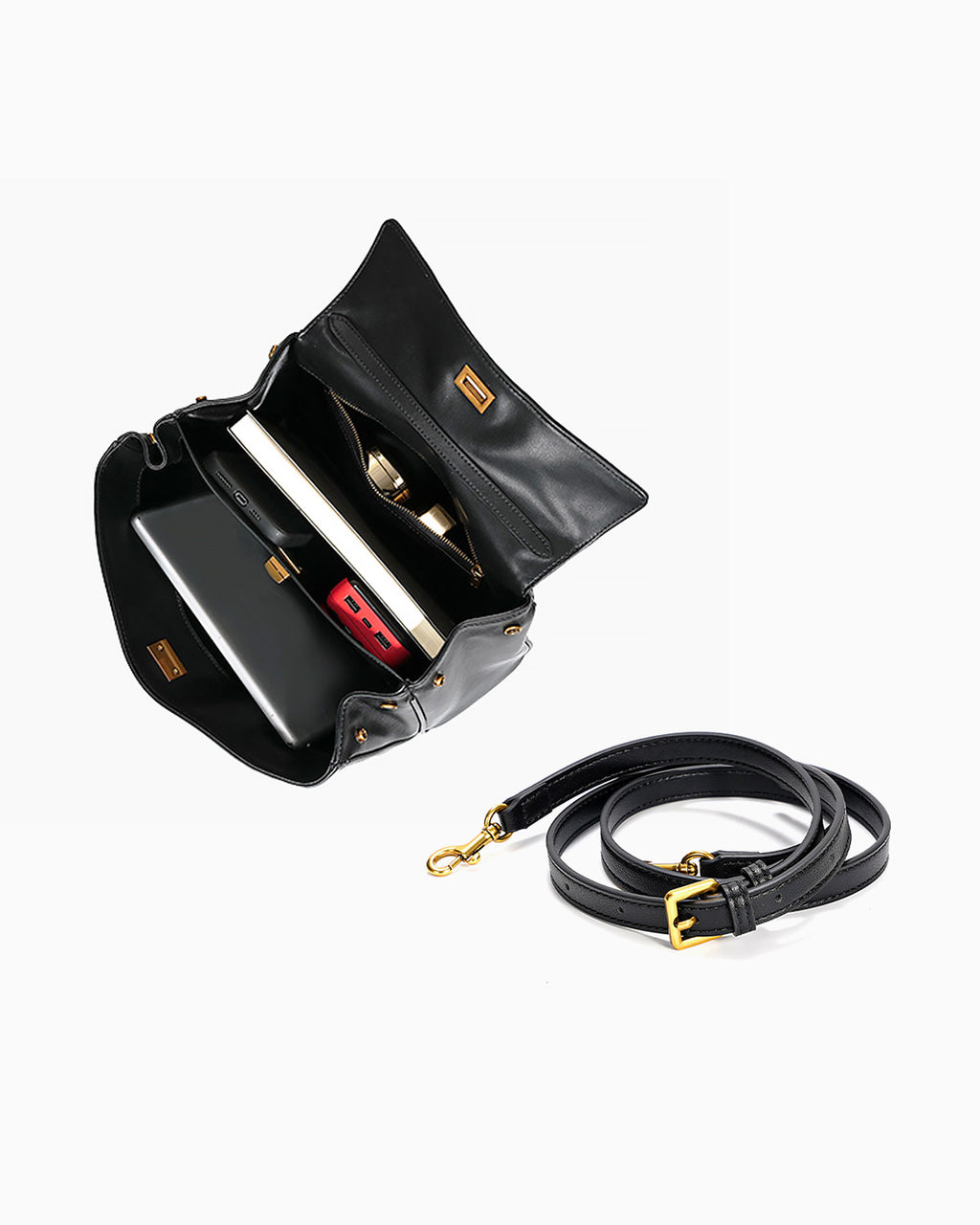 A black leather shoulder bag shown open, revealing interior compartments, alongside a detachable black shoulder strap with gold-tone hardware on a light gray background.