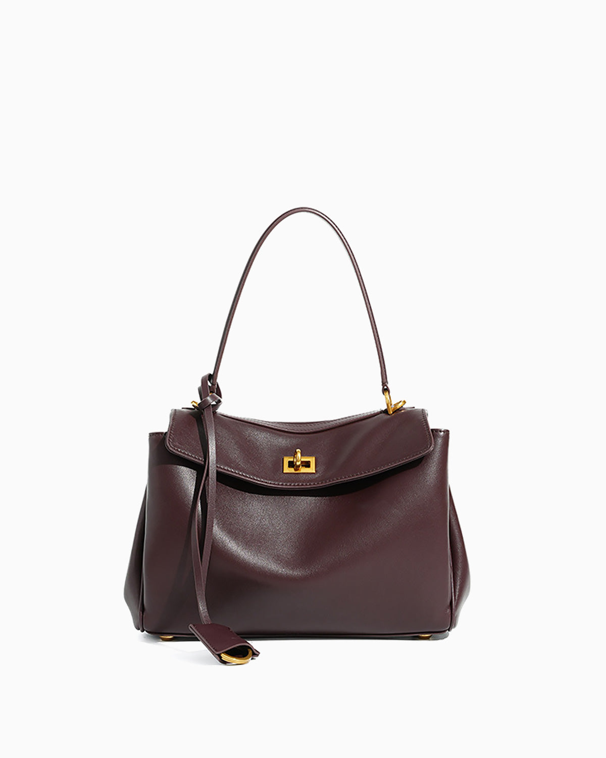 A dark burgundy leather handbag with a top handle, a detachable shoulder strap, and a gold-tone turn-lock clasp on a plain white background.