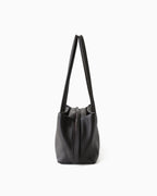 A side view on a Dark Brown Genuine Full-Grain Leather Commuter Shoulder Bag | BUCKLE Collective