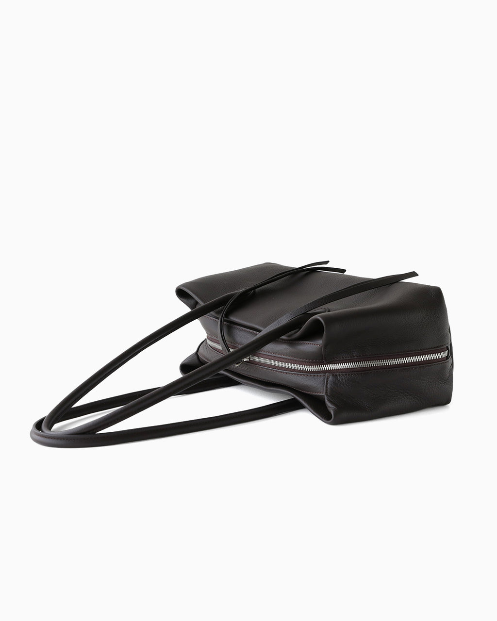 A side view on a Dark Coffee Brown Genuine Full-Grain Leather Commuter Shoulder Bag by BUCKLE Collective