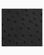 A close-up of a black genuine ostrich leather | BUCKLE Collective