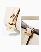 Genuine Togo Leather Bucket Bag with Lock and Key and removable pouch, Off-White color. Lock close up