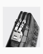 Close-up of a Black Genuine Siamese Crocodile Leather Wristlet Clutch with a Combination Lock