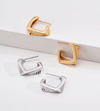 Square geometric hoop earrings in vintage gold and white gold silver — both colourways comparison, open square hoop with stripe texture, 18K gold plated S925 sterling silver, BUCKLE Collective