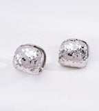 A pair of silver-toned Pillow Huggie Earrings with a textured, glitter finish 18K Gold Plated S925 Silver | BUCKLE Collective