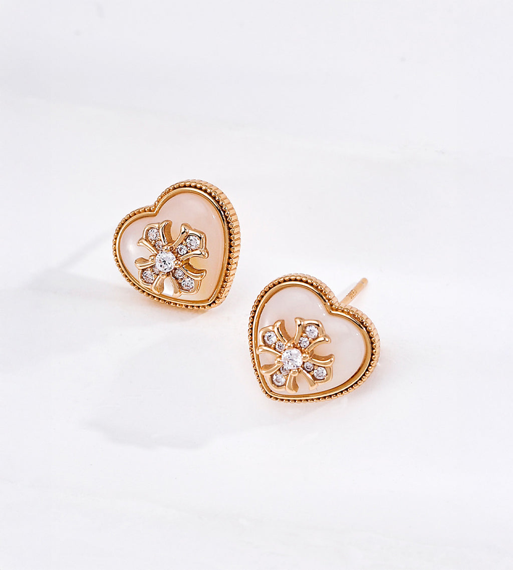Vintage Gold heart-shaped mother of pearl stud earrings with sparkling cubic zirconia flower accents and textured beaded borders.