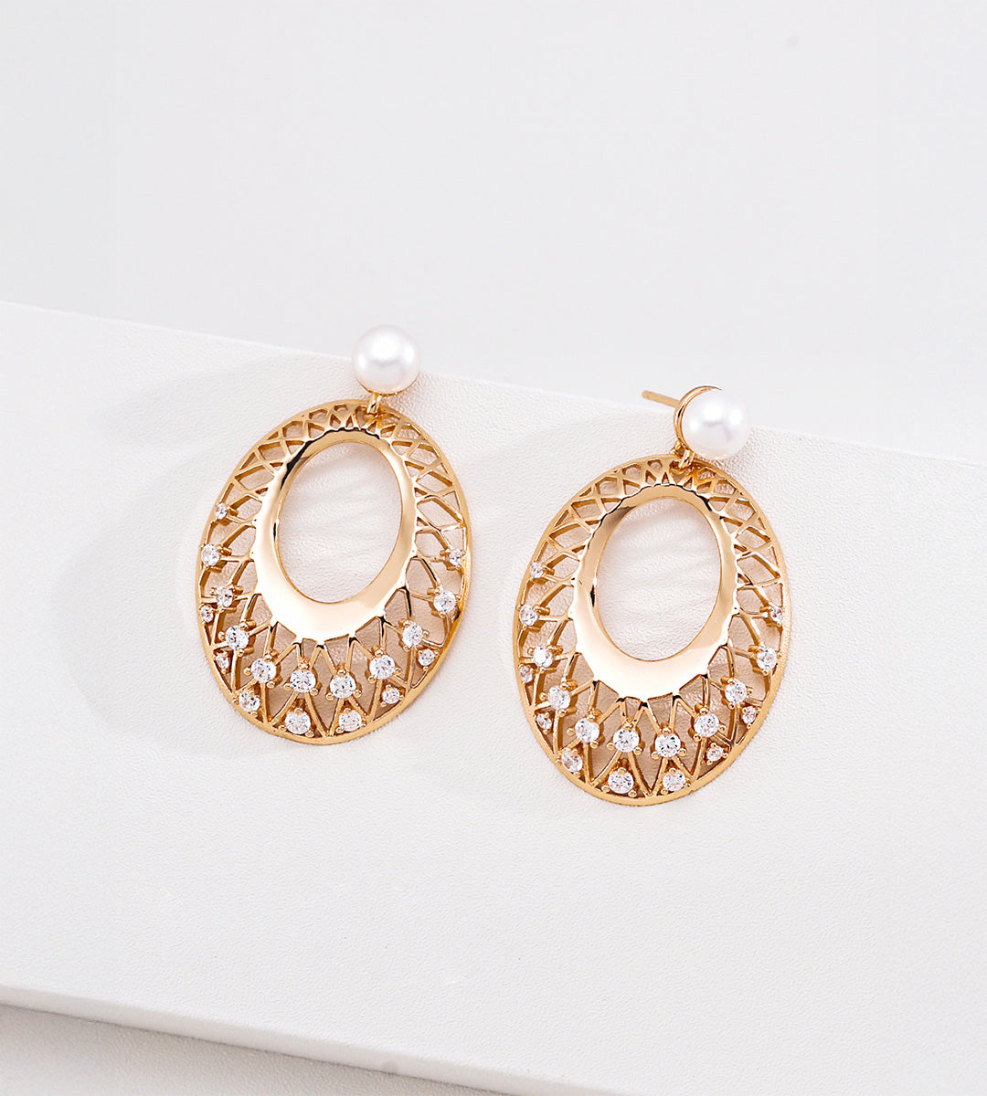 18K gold-plated S925 silver oval drop earrings with openwork lattice, cubic zirconia accents and freshwater pearl tops.